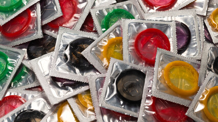 Colorful condoms background.