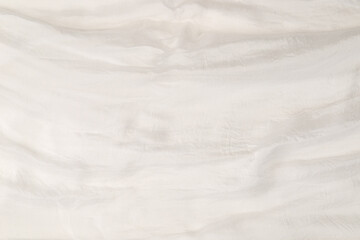 Soft smooth white silk fabric background. Fabric texture.