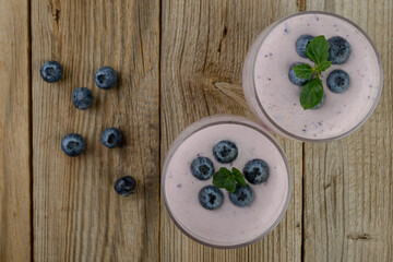 blueberry smoothie with  fresh berries on table