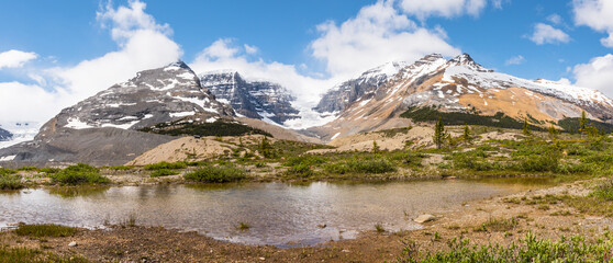 Beautiful Canadian landscape outdoors and snow capped rocky mountain range panorama at Columbia Icefields. Snow Dome glacier in the rocky mountains and glacial springs, Jasper National Park