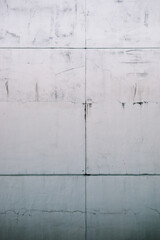 Concrete wall. Grunge urban background with the cracks. 