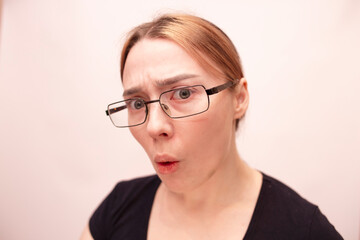 Fototapeta premium Young girl with glasses on a white background