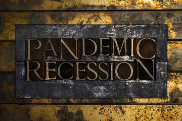 Pandemic Recession text on vintage textured bronze grunge copper and gold background
