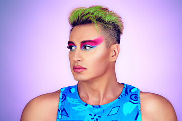 Beauty Fashion Muscular guy with Colorful Art Makeup, Green Hair. Sexy fitness man with make up. Handsome bodybuilder, healthy male athletic body, lgbtq concept. Happy positive motivation