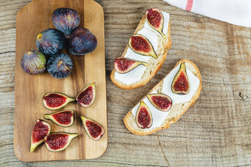 Figs cut on toast with cheese.