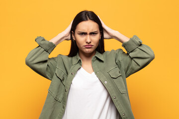 young hispanic woman feeling frustrated and annoyed, sick and tired of failure, fed-up with dull,...