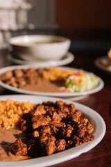 Mexican food beef beans and rice sitting in the sunlight