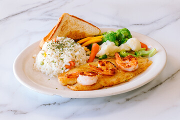 Mexican food grilled fish with shrimp steamed vegetables rice and toast