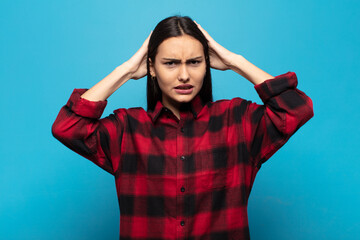 young hispanic woman feeling frustrated and annoyed, sick and tired of failure, fed-up with dull,...