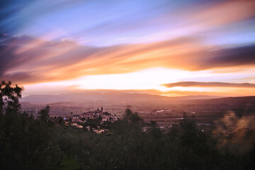Warm-colored sunset, fire-red clouds fade to pink, as night approaches, golden hour. long exposure photography