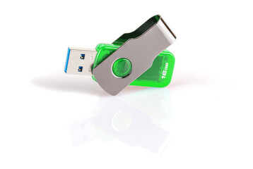 Green and silver USB 3.0 flash drive isolated on white background . USB Pen Drive or flash drive on white background. Close-up. Full depth of field.