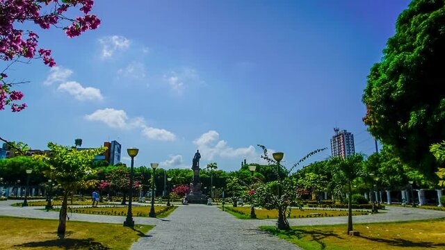 Time lapse of Saudade square with clouds and buildings in the background in Manaus 