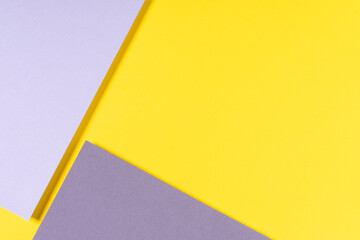 Abstract geometric paper background in yellow and gray colors. Top view