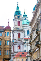Fototapeta premium Towers of the St Nicholas Church in Lesser Town of Prague, Czech republic