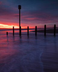 Colourful sunrise over Blyth Beach on the coast of Northumberland, England, UK.