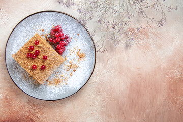 top view yummy cake slice with red berries on light background pie sweet cake biscuit