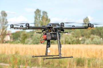 Big black homemade eight motor hexacopter on sky background.