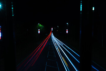 Fototapeta na wymiar on a bridge at night watching traffic.
