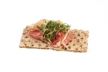 Variety of mini sandwiches with cream cheese, vegetables and salami.