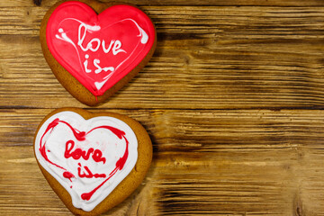 Heart shaped gingerbread cookies on wooden table.  Top view, copy space. Dessert for valentine day