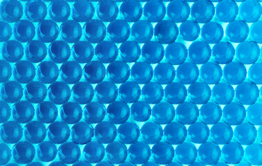 Bright blue hydrogel round shape. Macro gel balls. Concept of purity, clean, transparent, ideal and perfect. Beautiful classic abstract background. Perspective, geometry wallpaper