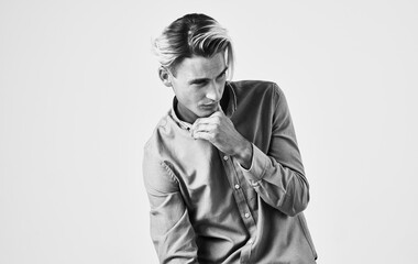 Romantic man in shirt gesturing with hands black and white photography light background cropped view