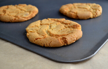 Home baked cookies on baking tray