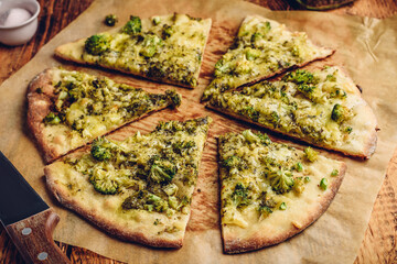 Slices of pizza with broccoli and cheese