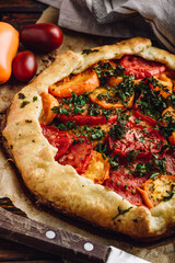 Baked tomato galette on baking paper