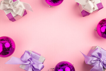 top view cute little presents with xmas tree toys on a pink background gift color new year christmas photo