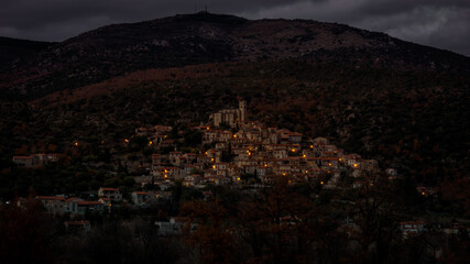 Fototapeta premium Eus à la tombée du jour, a small catalan village in the mountain brighting at dusk