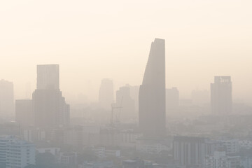 Cityscape of buildings and skyscrapers of Bangkok city covering with smog, dusk, high PM 2.5 air pollution in serious and dangerous level to health.