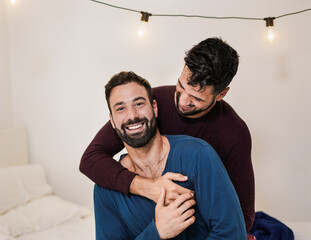 Gay men couple hugging each other at home - Homosexual love and relationship