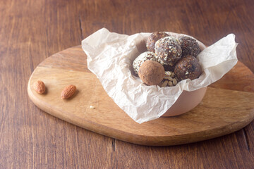 Raw vegan healthy energy balls with oatmeal, chia seed, coconut flakes, cocoa, almond and dried fruits