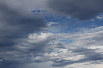 Blue sky with rain-laden clouds
