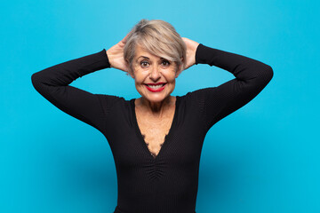middle age woman feeling stressed, worried, anxious or scared, with hands on head, panicking at...