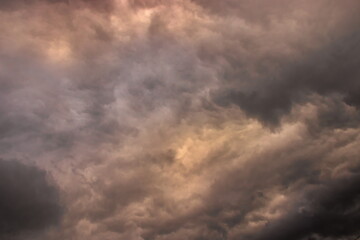 Fototapeta na wymiar dark clouds advancing over a small patch of blue sky.