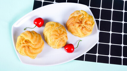 Homemade soes pastry vanilla fla.. Profiterole, Eclair, Cream Puff or Popular as Kue Soes, Filled with Milky Cream.
