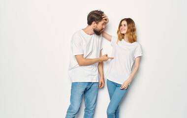 Couple in love man and woman light background fun emotions the same clothes