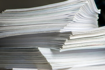 bundles bales of paper documents. stacks packs pile on the desk in the office