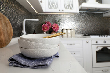 Beautiful ceramic dishware on countertop in modern kitchen