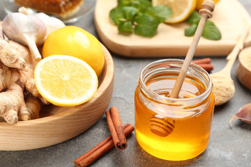 Different fresh products on grey table, closeup. Natural antibiotics