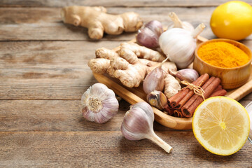 Different fresh products on wooden table, space for text. Natural antibiotics