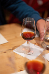 Professional tasting of different fortified dessert ruby, tawny port wines in glasses in porto cellars in Vila Nova de Gaia, Portugal