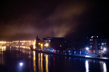 Fototapeta premium Small Belgian town Dinant on Meuse river in Walloon, Belgium at night