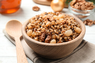 Traditional Christmas slavic dish kutia in bowl on white table, closeup