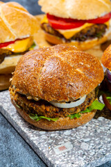Healthy vegan or vegetarian fast food, fresh made plant based burgers with vegetables