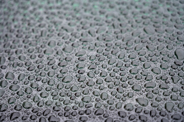 Textured background with rain waterdrops on glass