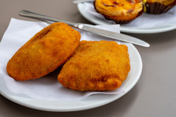 Street food in Portugal, savory pastries with meat or fish served for lunch