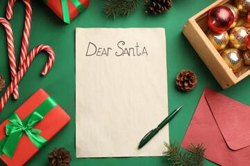 Fototapeta na wymiar Flat lay composition with letter saying Dear Santa on green background. Space for text